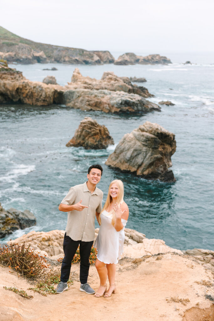 couple smiling at the camera during their big sur session