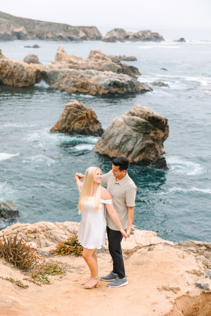 couple having fun during their big sur engagement session