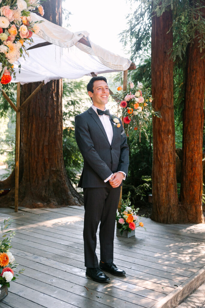 Groom waiting for his bride to walk down the aisle for his Santa Cruz wedding